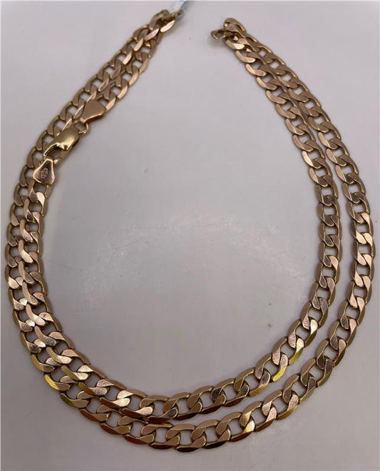 9ct yellow gold chain with a delicate link design, showcasing a shiny, polished finish on a plain background.