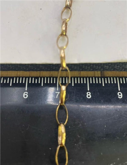 9ct yellow gold chain with delicate link design, unbranded, showcasing a shiny, polished finish.