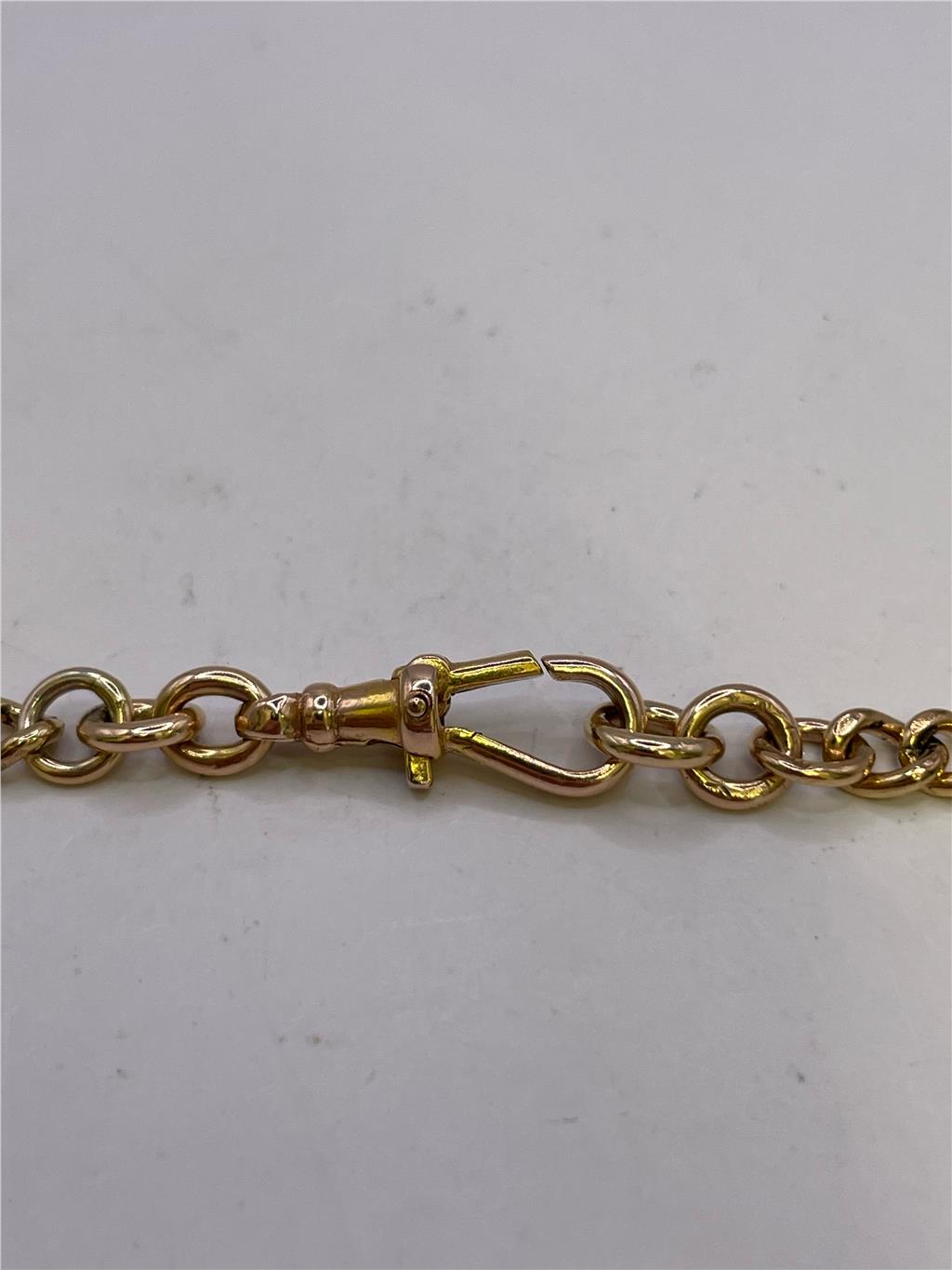 9ct yellow gold chain weighing 36.8g, unbranded, with a detailed close-up of the shiny, textured gold links.