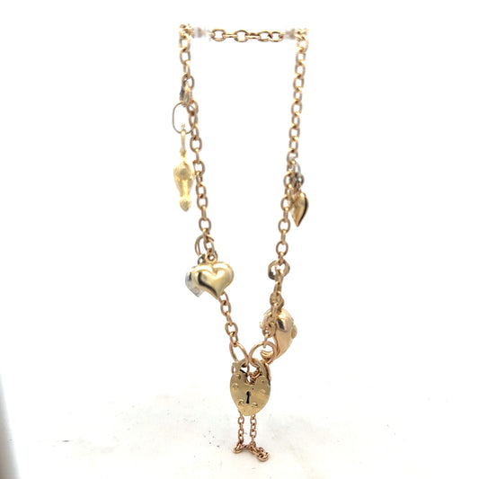 9ct yellow gold charm bracelet, 5.4g, with intricate charms and link design, crafted in unbranded jewelry style.