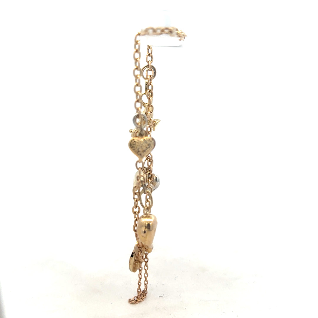 9ct yellow gold charm bracelet weighing 5.4g, with intricate charm details, unbranded jewelry accessory.