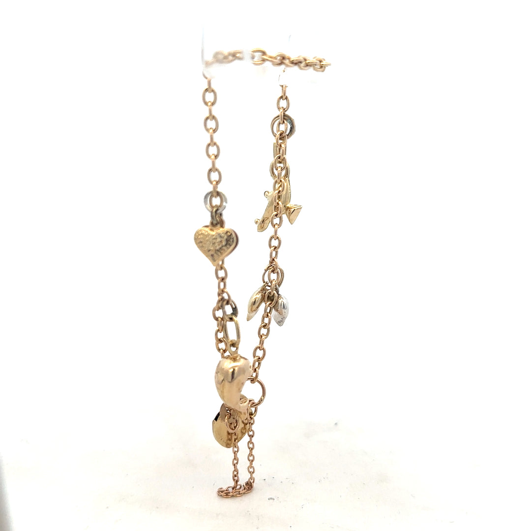 9ct yellow gold charm bracelet weighing 5.4g with decorative charms, unbranded, displayed on a neutral background.