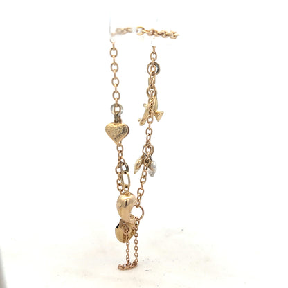 9ct yellow gold charm bracelet weighing 5.4g with decorative charms, unbranded, displayed on a neutral background.