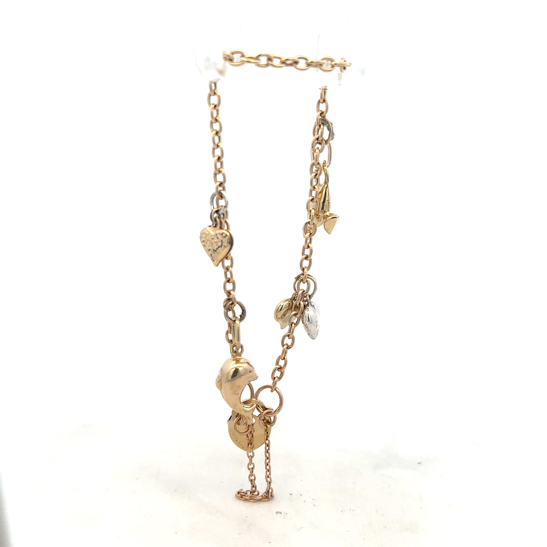 9ct yellow gold charm bracelet weighing 5.4g, featuring various decorative charms, unbranded jewelry accessory.