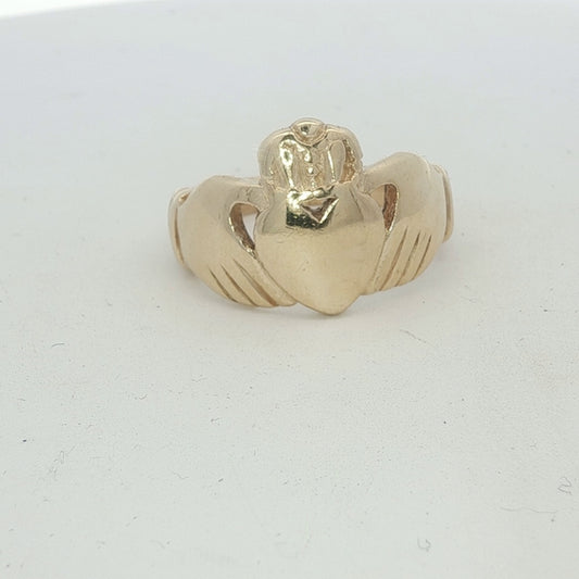 9ct yellow gold Claddagh ring with detailed heart and crown design, unbranded jewelry piece.