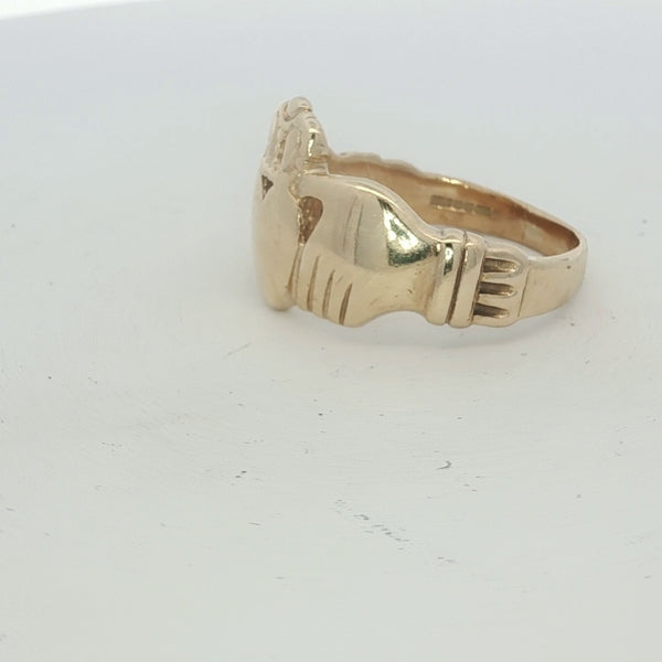 9ct yellow gold Claddagh ring with detailed heart and hands design, unbranded jewelry piece showcasing traditional Irish craftsmanship.
