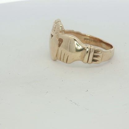 9ct yellow gold Claddagh ring with detailed craftsmanship, featuring a heart, hands, and crown design.