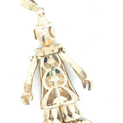 9ct yellow gold clown pendant weighing 20.3g, unbranded, featuring a detailed clown design on a shiny gold surface.
