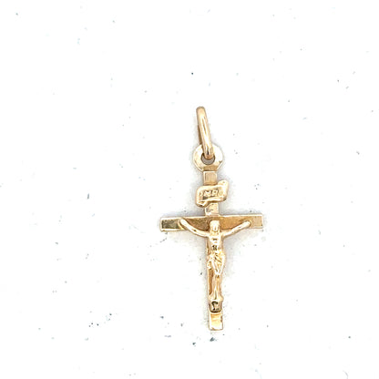 9ct yellow gold cross pendant weighing 1.3g, unbranded jewelry with detailed cross design and polished finish.