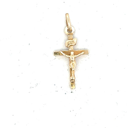 9ct yellow gold cross pendant weighing 1.3g, unbranded jewelry with detailed design visible in the image.