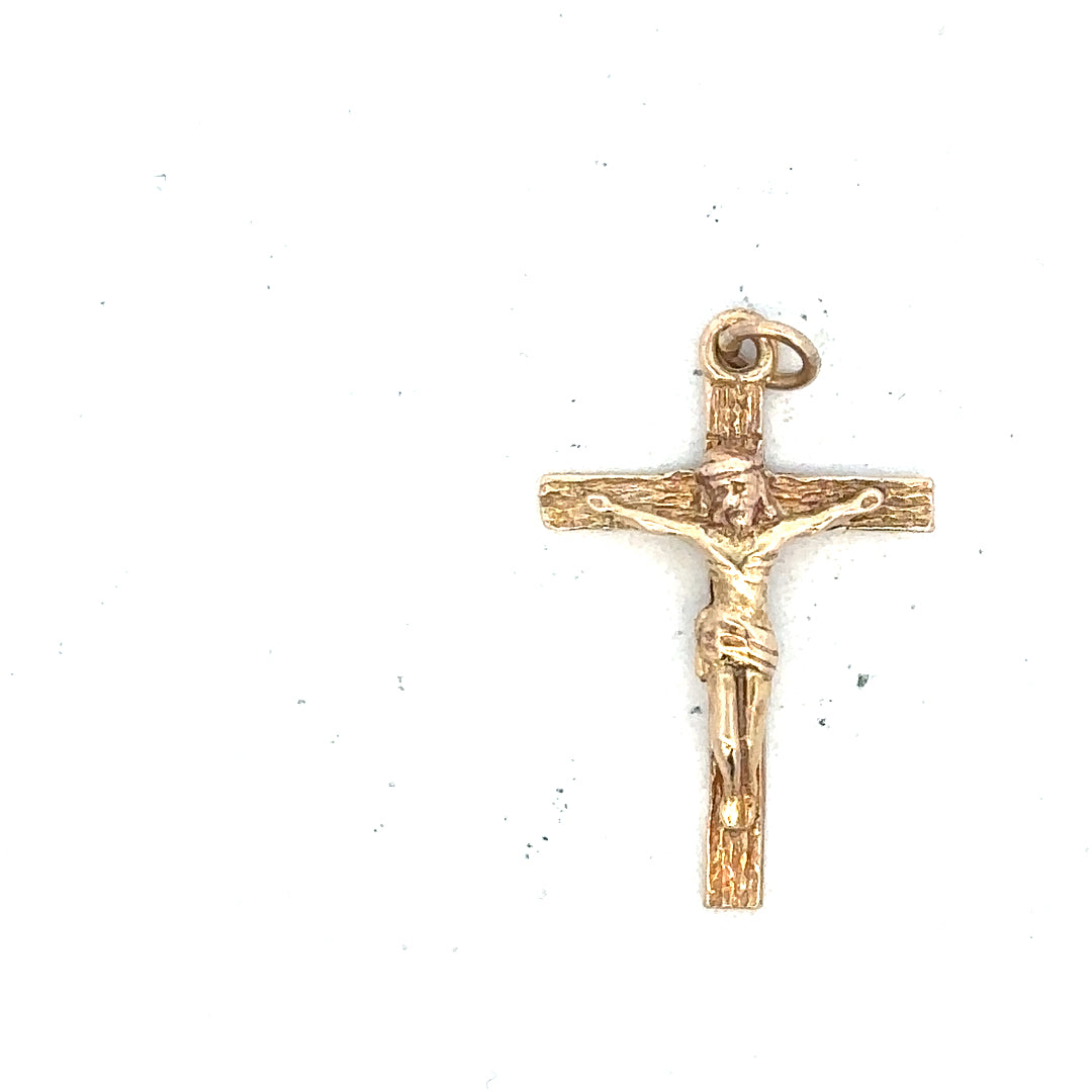 9ct yellow gold cross pendant weighing 1.6g, unbranded, with detailed design visible on the gold jewelry piece.