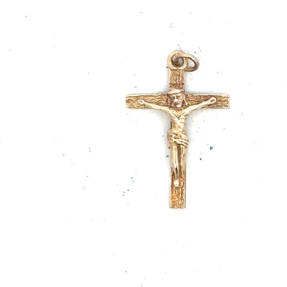9ct yellow gold cross pendant weighing 1.6g, featuring a classic design with detailed craftsmanship.