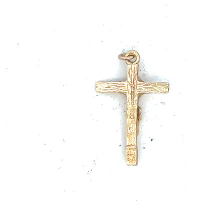 9ct yellow gold cross pendant weighing 1.6g, unbranded jewelry with detailed craftsmanship and classic religious design.