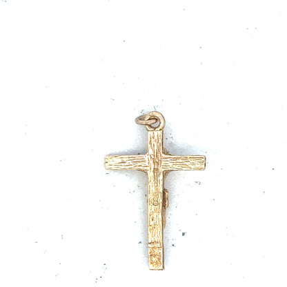 9ct yellow gold cross pendant weighing 1.6g, unbranded jewelry with detailed design, shown on a plain background.