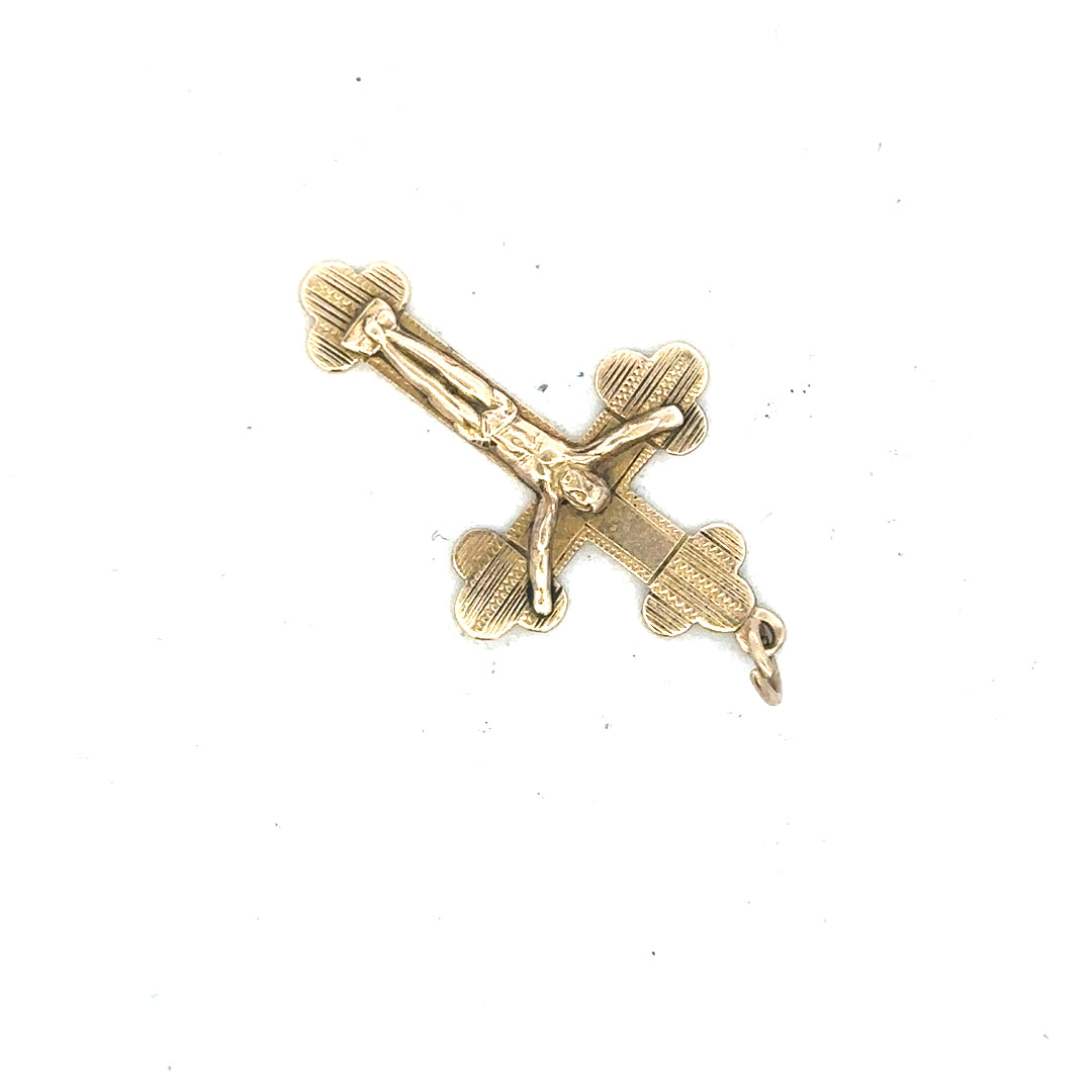 9ct yellow gold cross pendant weighing 2.7g, showcasing detailed craftsmanship and classic religious jewelry design.