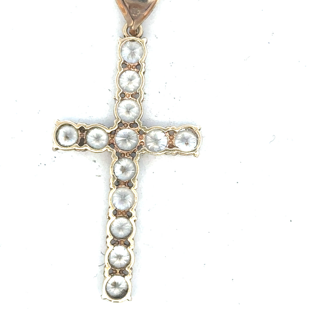 9ct yellow gold cross pendant weighing 5.1g, unbranded jewelry with detailed design and polished finish.