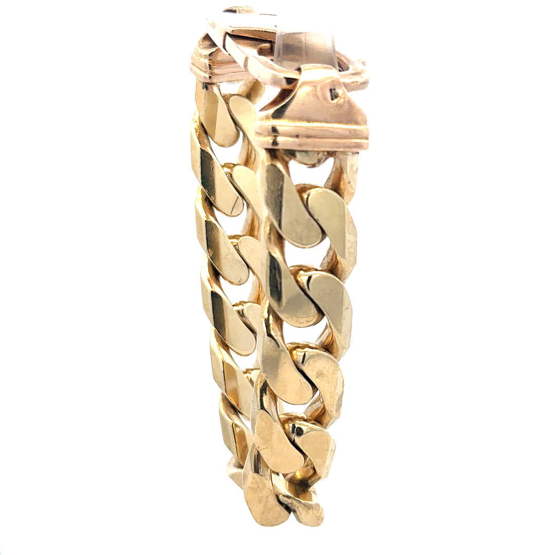 9ct yellow gold curb bracelet weighing 127g, featuring a classic chain design with a secure clasp.
