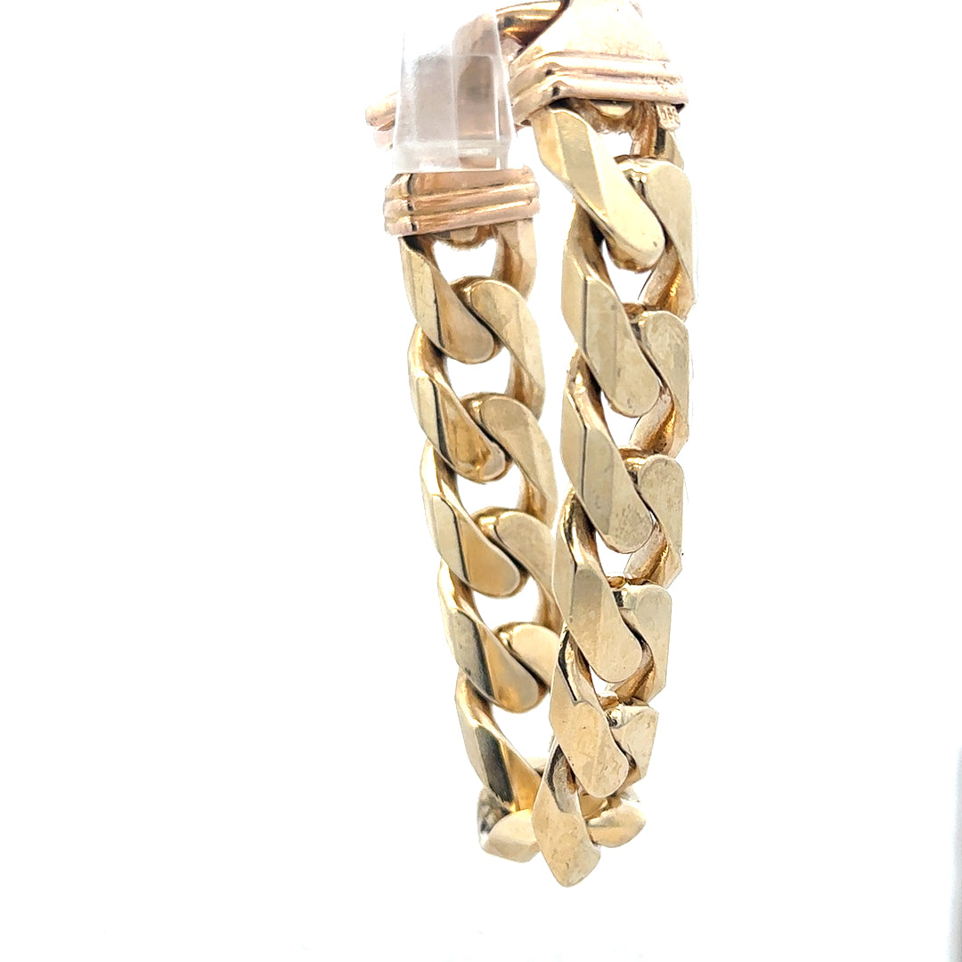 9ct yellow gold curb bracelet weighing 127g, featuring classic chain links and a polished finish.