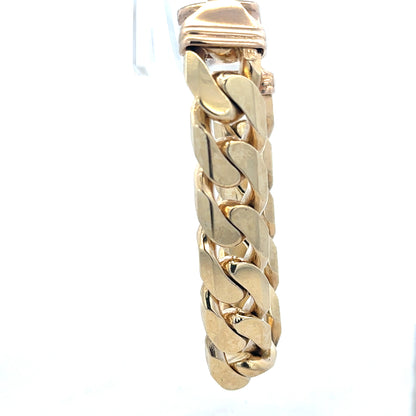 9ct yellow gold curb bracelet weighing 127g, unbranded jewelry with a classic chain design, shown in a close-up image.