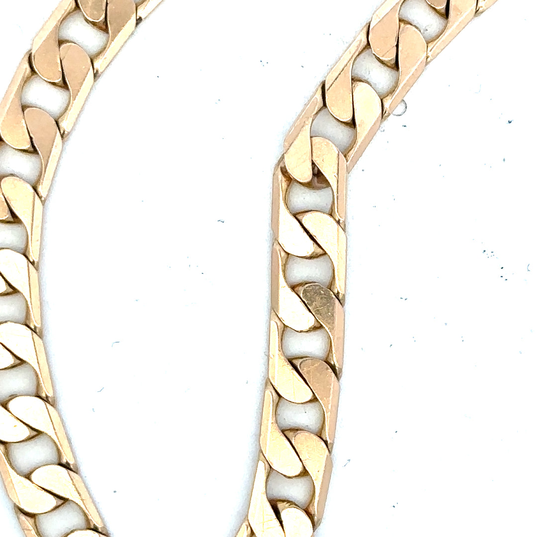 9ct yellow gold curb bracelet weighing 14.5g, featuring classic linked chain design, unbranded jewelry accessory.