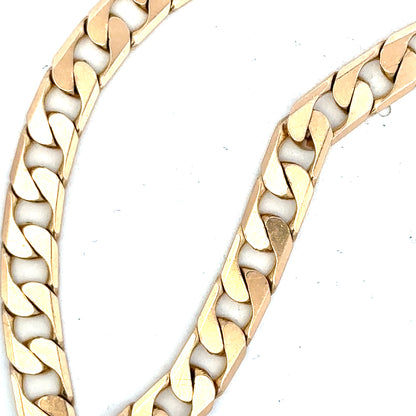 9ct yellow gold curb bracelet weighing 14.5g, featuring classic linked design on a plain background.