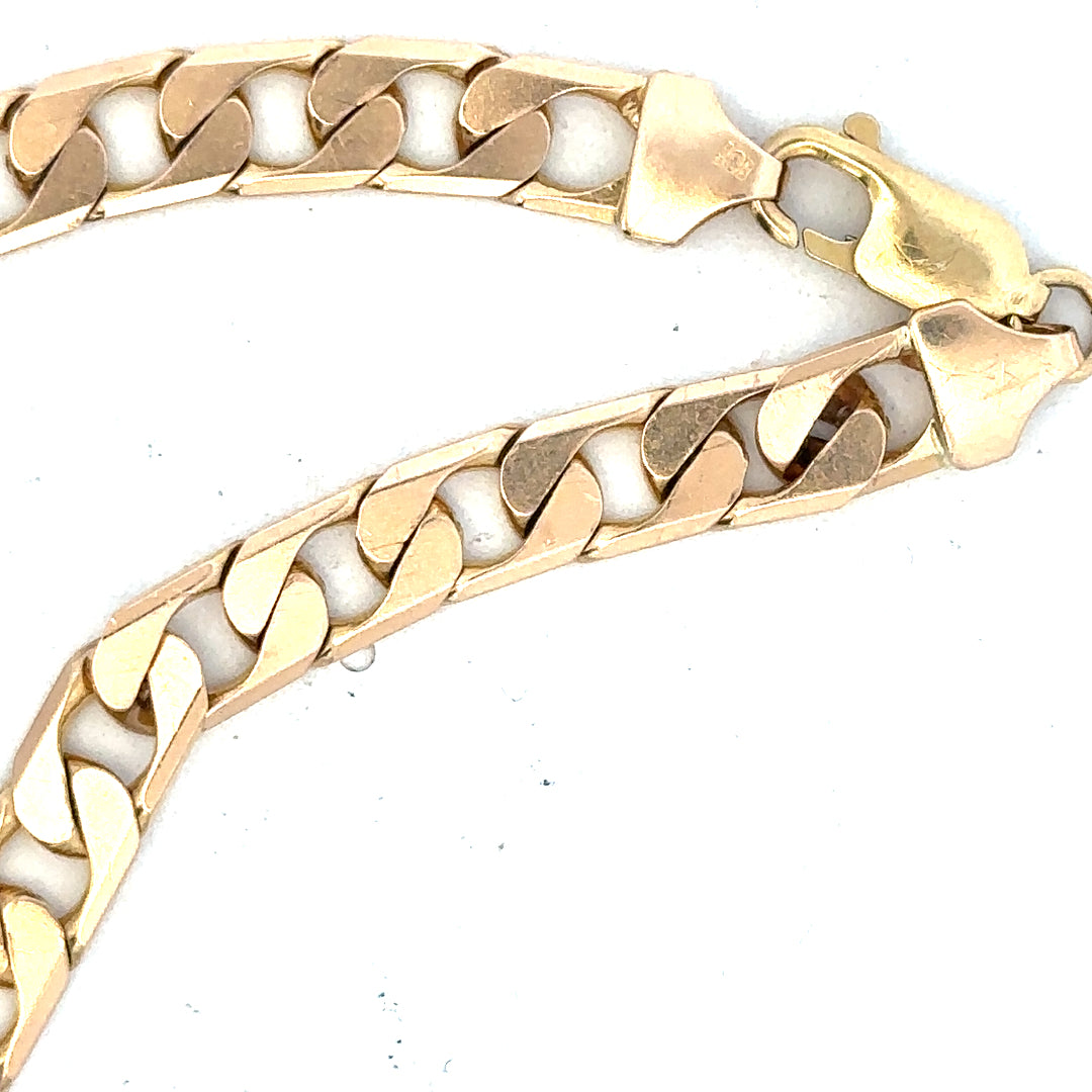 9ct yellow gold curb bracelet weighing 14.5g, displayed on a neutral background, showcasing its classic gold link design.
