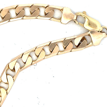 9ct yellow gold curb bracelet weighing 14.5g, displayed on a neutral background, showcasing its classic gold link design.