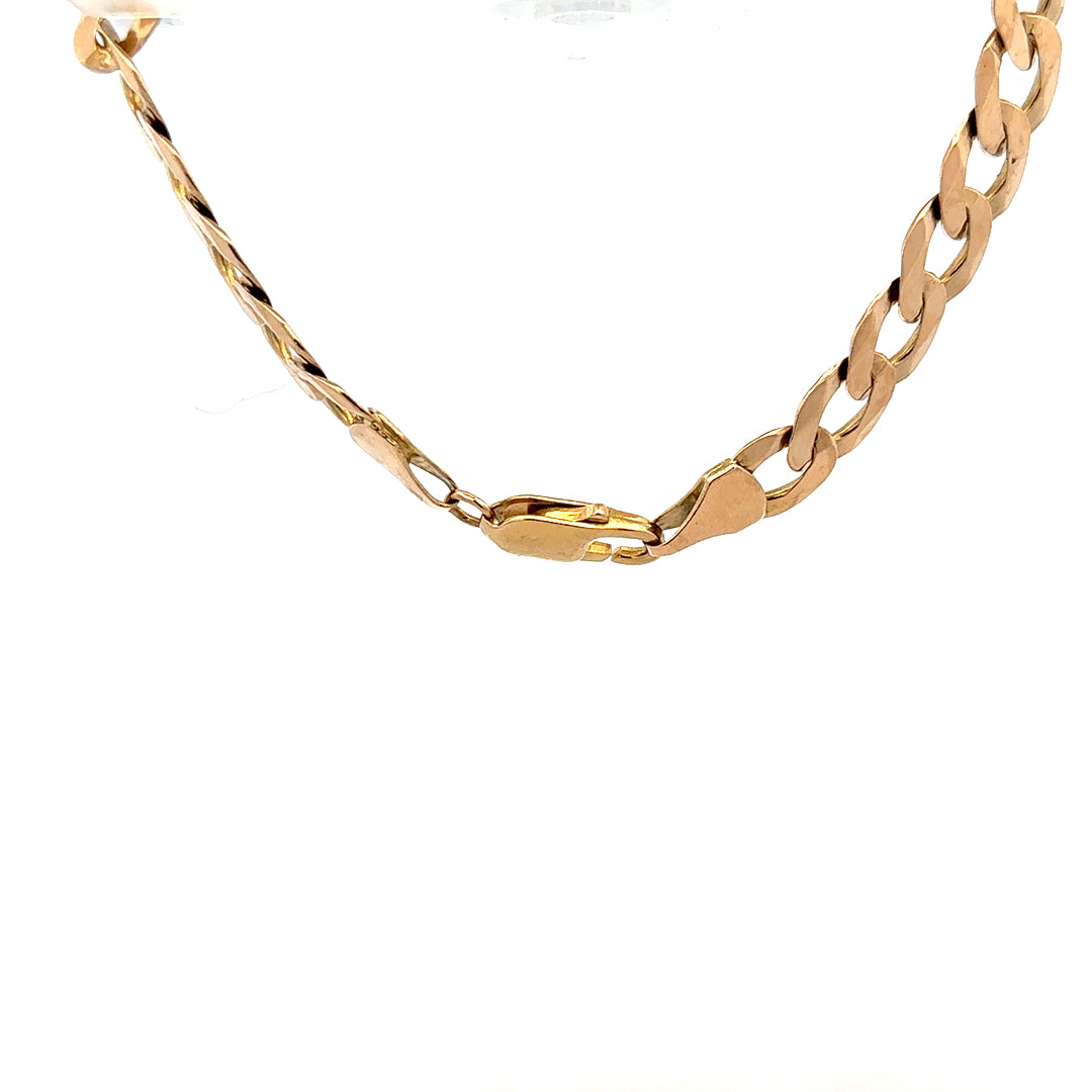 9ct yellow gold curb bracelet weighing 15.5g, featuring a classic linked chain design, unbranded.