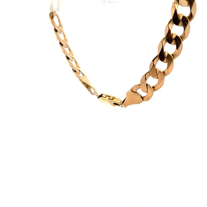 9ct yellow gold curb bracelet weighing 15.5g, featuring a classic linked chain design, unbranded, on a plain background.