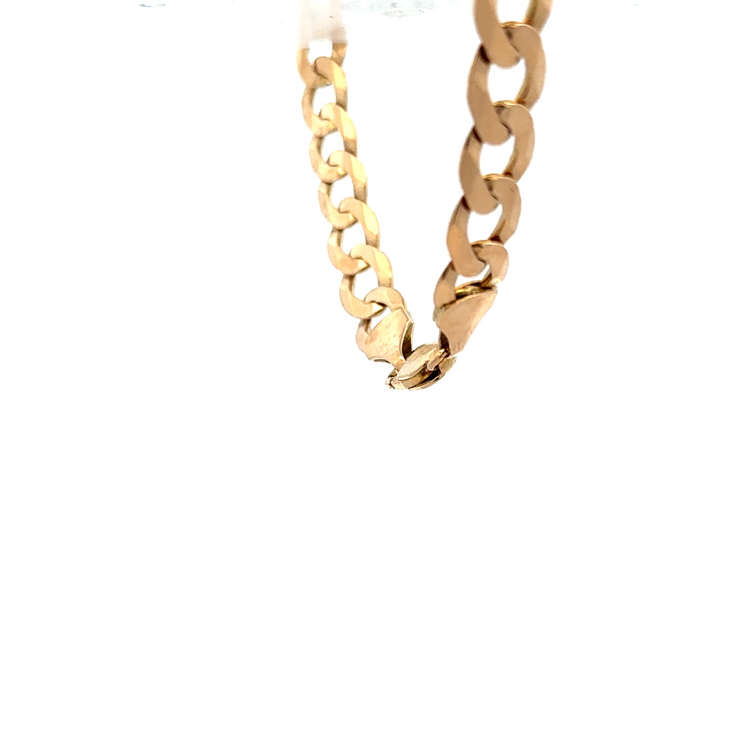 9ct yellow gold curb bracelet weighing 15.5g, featuring interlinked flat oval links, unbranded jewelry accessory.