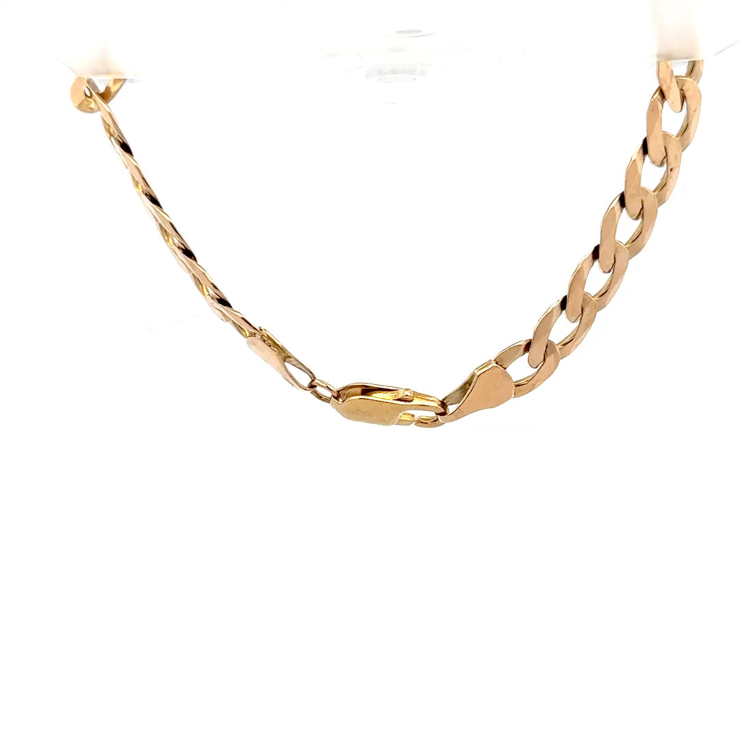 9ct yellow gold curb bracelet weighing 15.5g, featuring interlocking links, unbranded jewelry piece displayed on a neutral background.