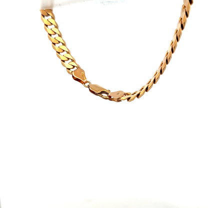 9ct yellow gold curb bracelet weighing 17.1g, featuring classic interlinked chain design, unbranded jewelry accessory.