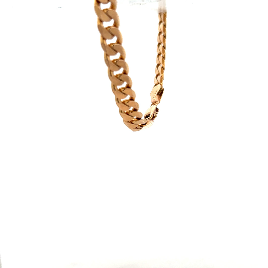 9ct yellow gold curb bracelet weighing 17.1g with a polished finish, featuring interlinked flat oval links.