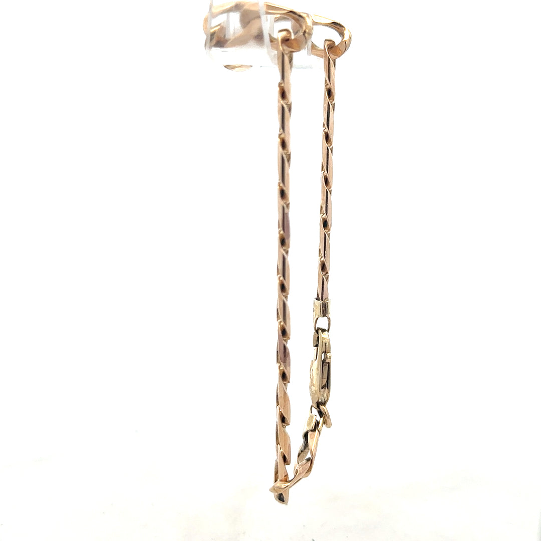 9ct yellow gold curb bracelet weighing 18.3g, showcasing a classic gold chain design with a secure clasp.