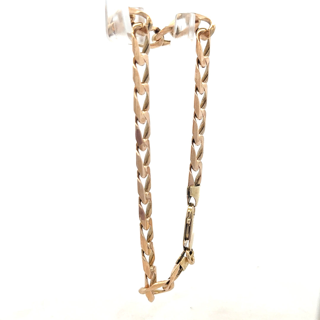 9ct yellow gold curb bracelet weighing 18.3g, featuring a classic chain design with a secure clasp.