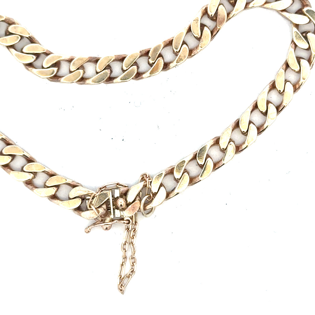 9ct yellow gold curb bracelet weighing 20g with a classic chain design, unbranded, showcasing polished gold links.
