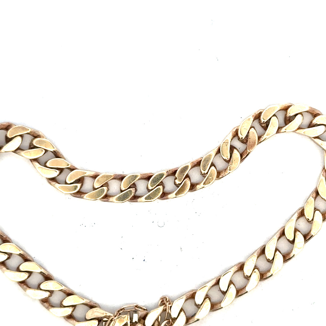 9ct yellow gold curb bracelet weighing 20g with a classic link design, showcasing polished gold links.