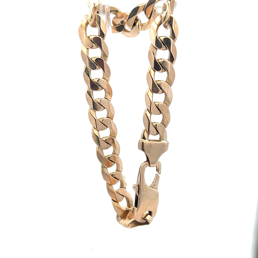 9ct yellow gold curb bracelet weighing 31.9g, unbranded, featuring a classic chain design and polished finish.