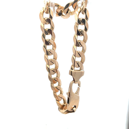 9ct yellow gold curb bracelet weighing 31.9g, unbranded, featuring a classic chain design and polished finish.