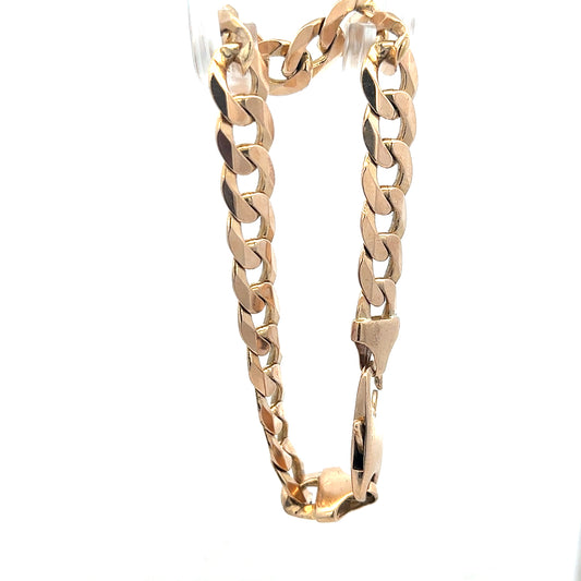 9ct yellow gold curb bracelet weighing 31.9g, unbranded jewelry with a classic linked chain design.
