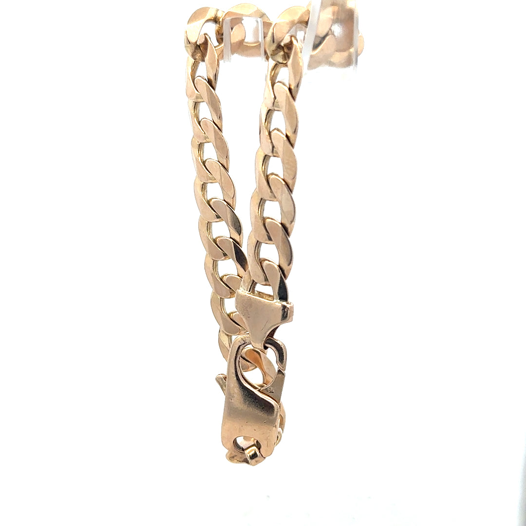 Unbranded 9ct yellow gold curb bracelet, 31.9g, detailed links with a polished finish, shown on a neutral background.