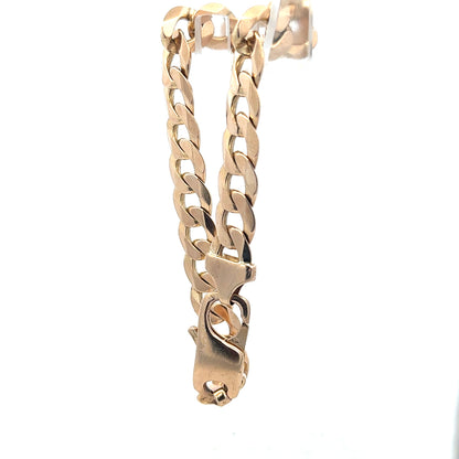 Unbranded 9ct yellow gold curb bracelet, 31.9g, detailed links with a polished finish, shown on a neutral background.