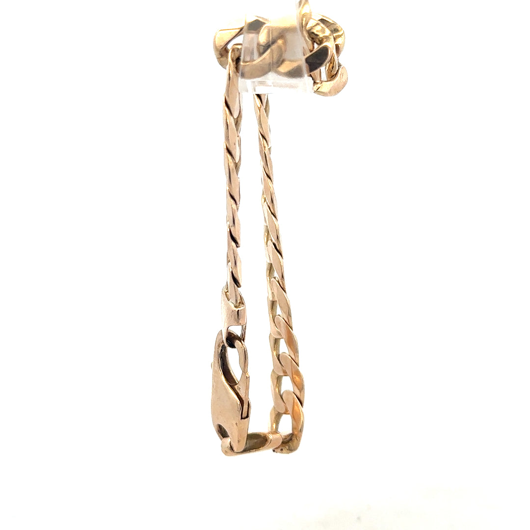 9ct yellow gold curb bracelet weighing 31.9g, unbranded, shown with detailed links and polished finish.