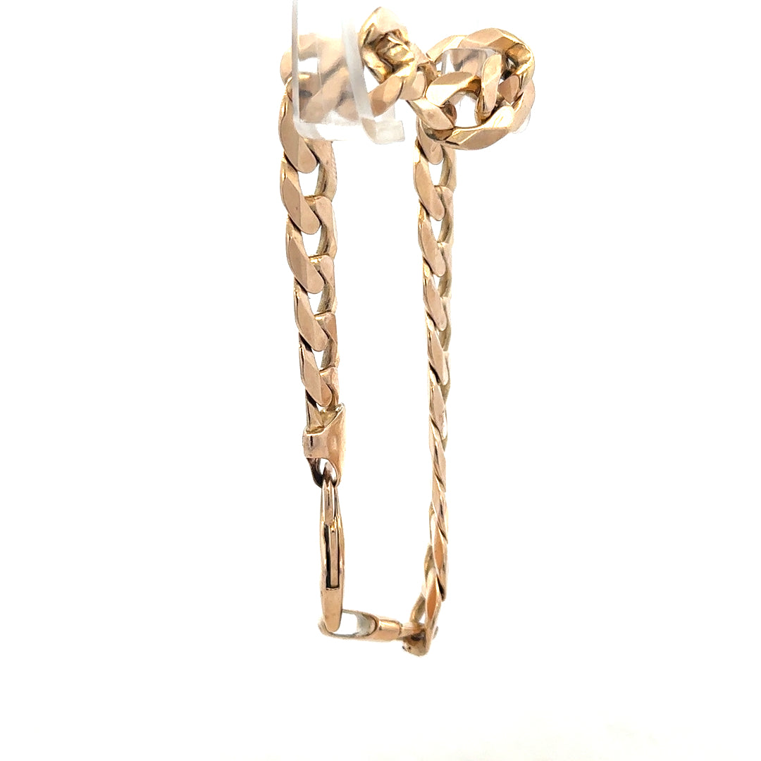 9ct yellow gold curb bracelet with a polished finish, weighing 31.9g, featuring linked chain design and secure clasp.