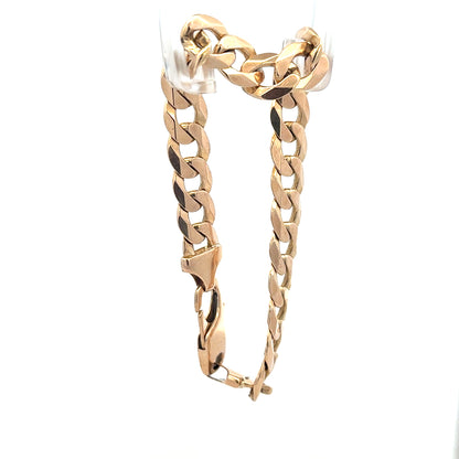 9ct yellow gold curb bracelet weighing 31.9g, unbranded jewelry with a classic chain design.