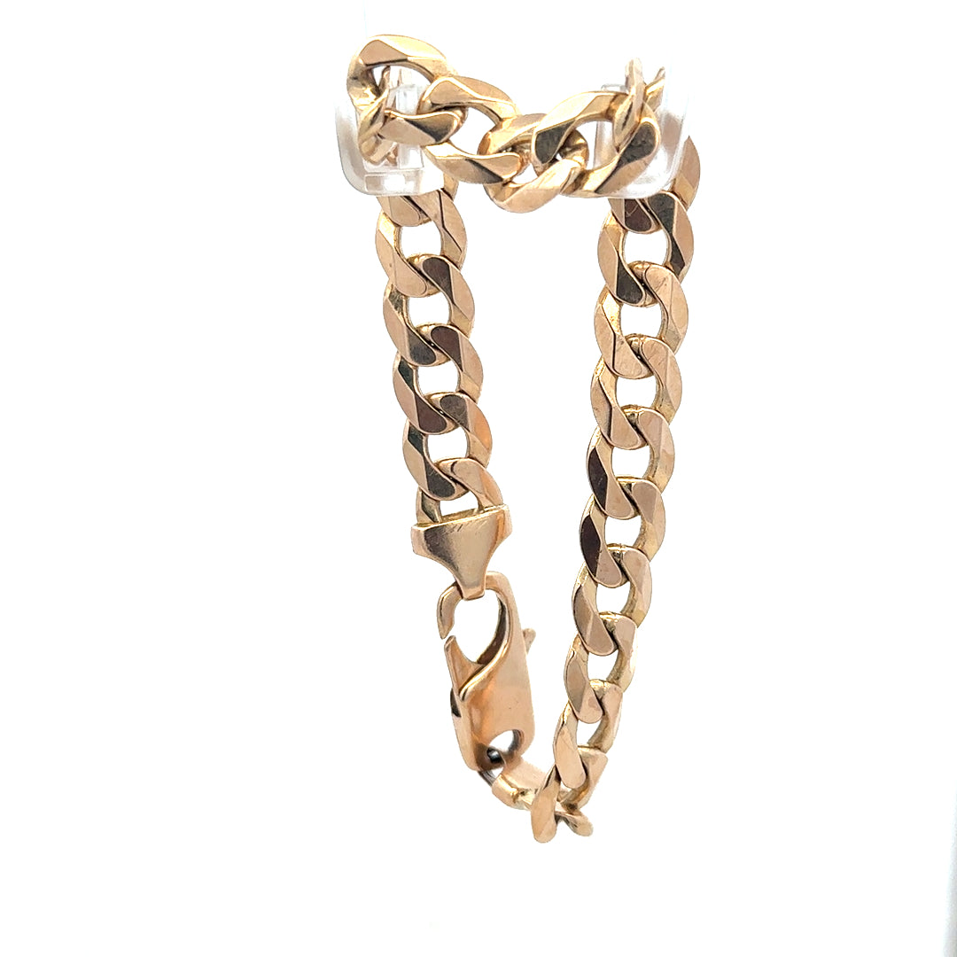 9ct yellow gold curb bracelet weighing 31.9g, unbranded, featuring classic interlinked chain design, shown on a white background.