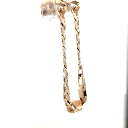 9ct yellow gold curb bracelet weighing 31.9g with a classic chain design, unbranded jewelry piece.