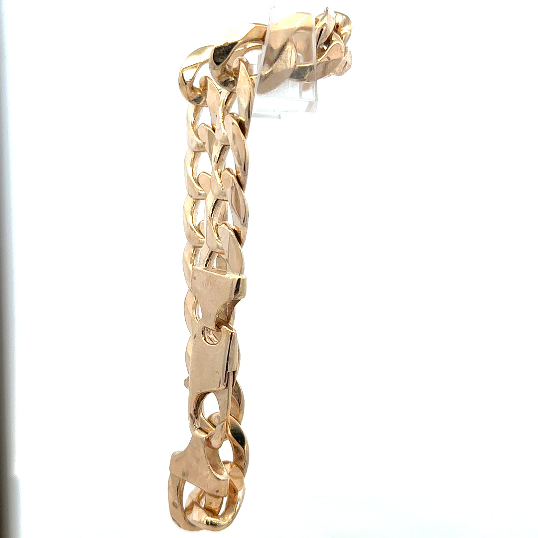 9ct yellow gold curb bracelet weighing 47.5g, unbranded, with a classic chain link design, shown in a close-up image.