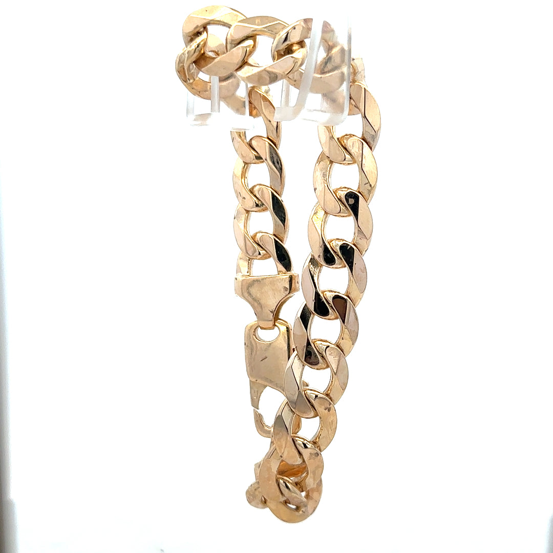 9ct yellow gold curb bracelet weighing 47.5g, featuring classic linked design, unbranded, shown in a detailed close-up image.