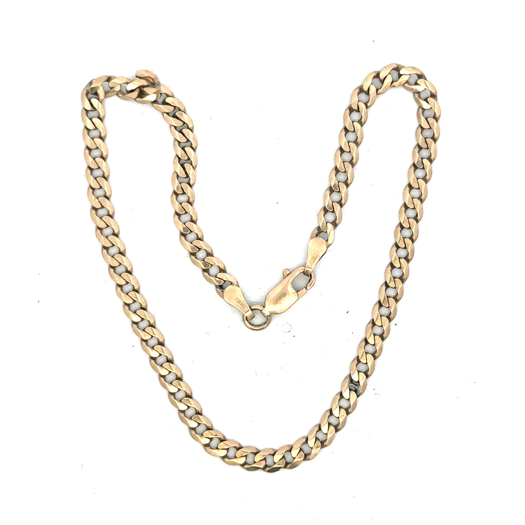 9ct yellow gold curb bracelet weighing 5.2g, unbranded, featuring classic linked design, shown in a close-up image.
